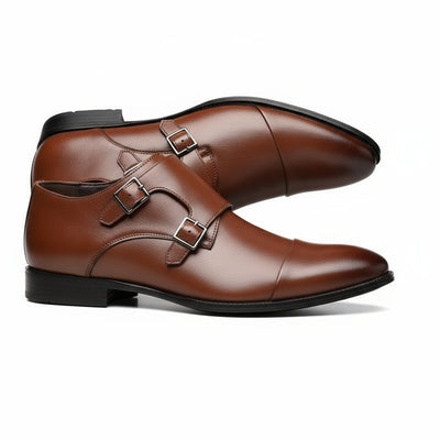 Brown leather shoes with buckles on a white background